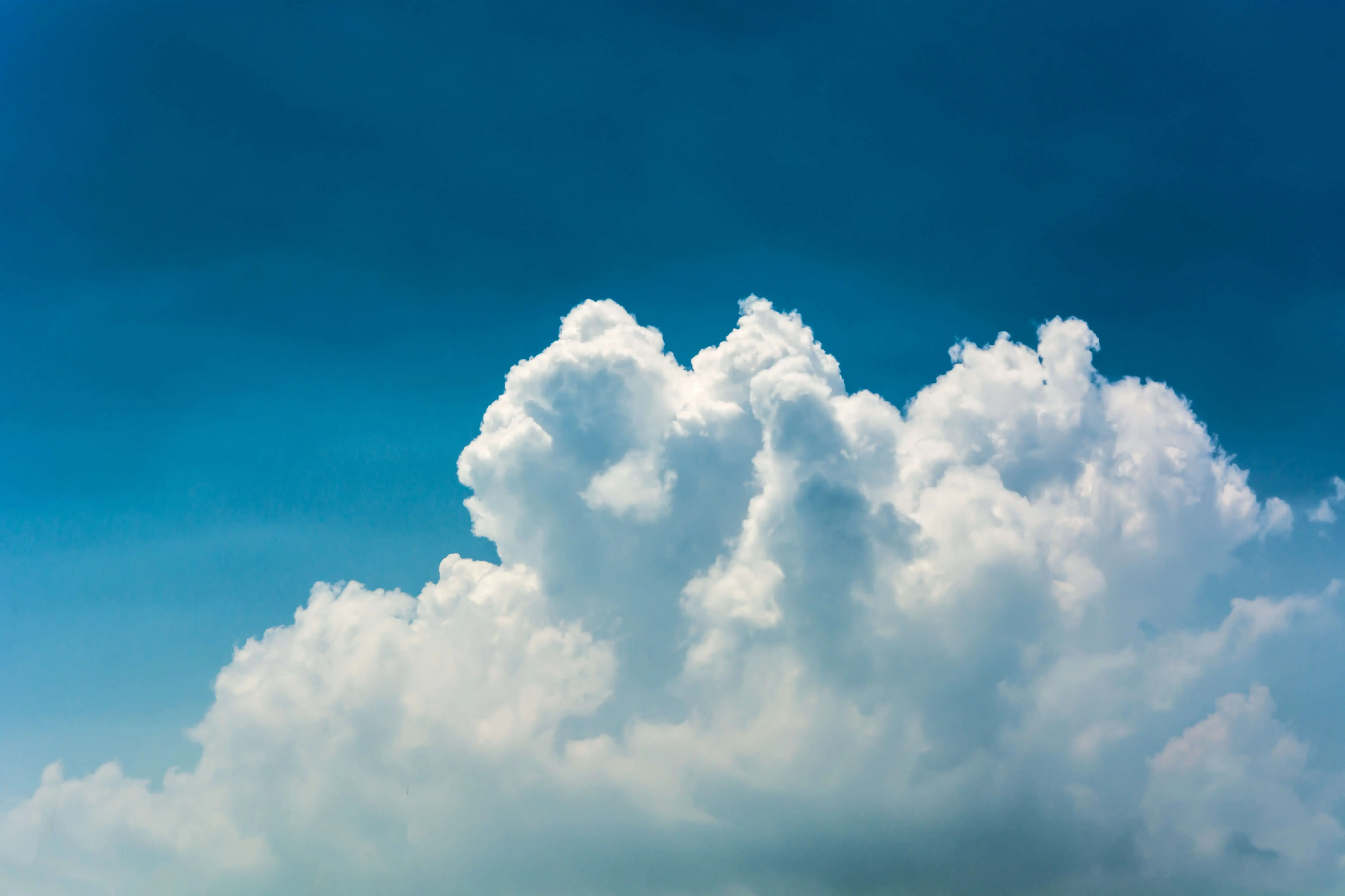 clouds in a dark blue sky